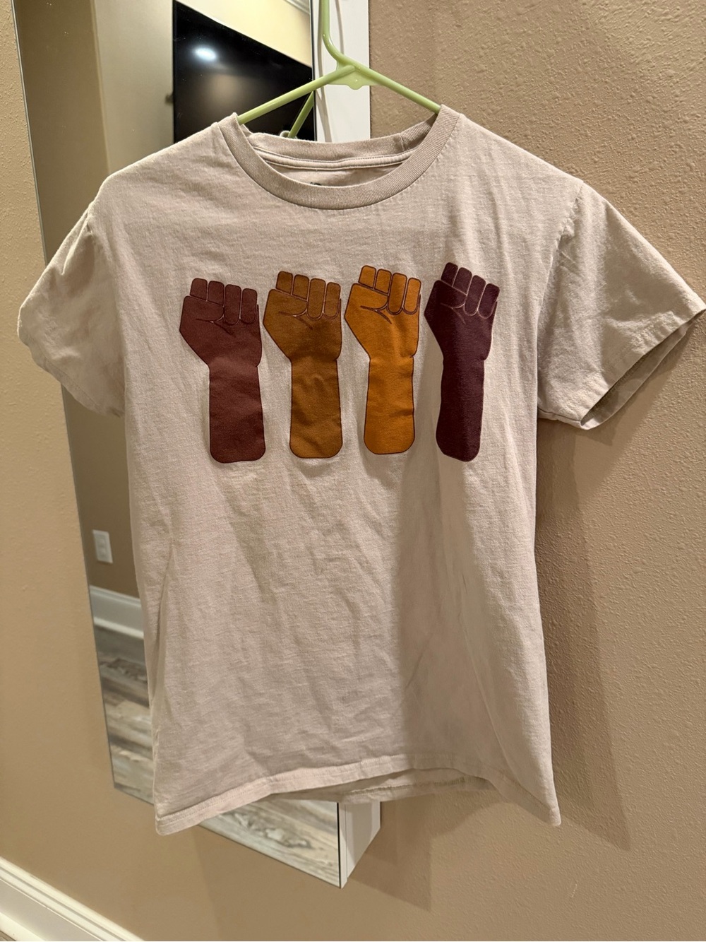 Beige Short-Sleeve Tee with Raised Fist Graphic